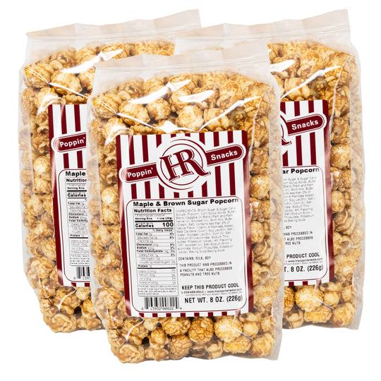 Three packages of HR Poppin' Snacks Maple & Brown Sugar Popcorn on a white background