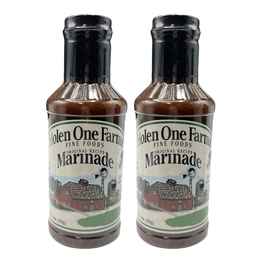 Two bottles of Holen One Farms Marinade on a white background