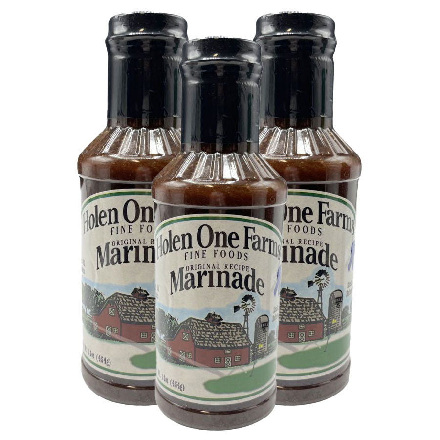Three bottles of Holen One Farms Marinade on a white background
