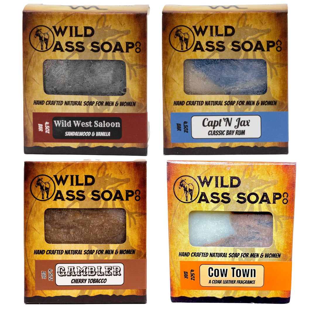 Four boxes of Wild Ass Soap with different scents on a white background