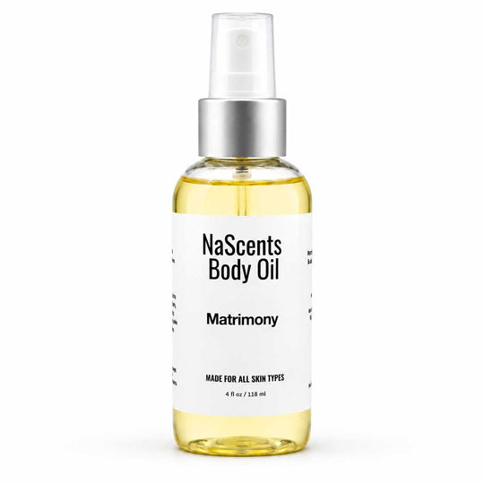 A 4 fl oz clear glass bottle of NaScents Body Oil, specifically the 'Matrimony' scent, filled with pale yellow oil and featuring a white label with black text and a silver spray nozzle, set against a plain white background.