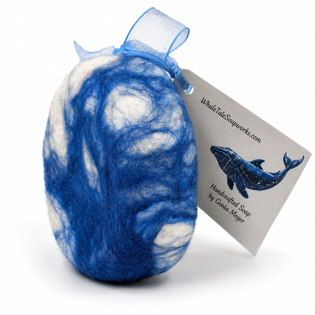 Blue and white textured soap with a whale illustration and 'Whale Tale Soapworks' tag on a white background