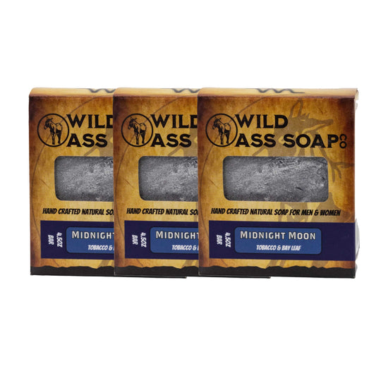 Three bars of Wild Ass Soap in packaging on a white background