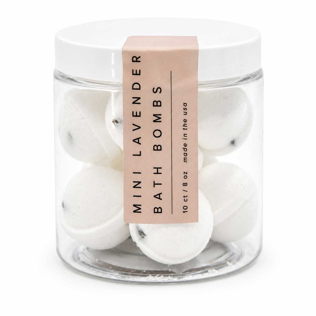 Jar of mini lavender bath bombs with a label on a white background