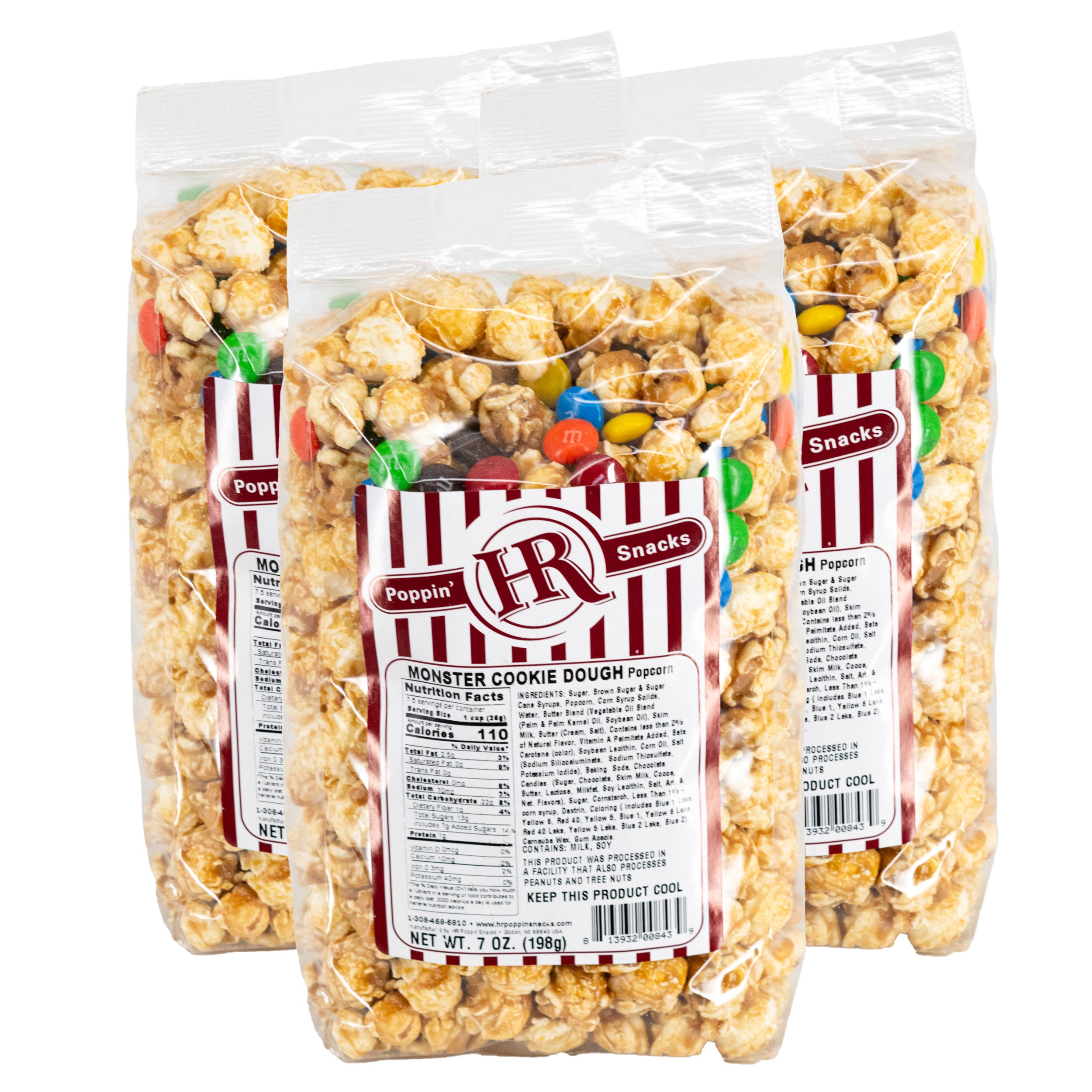 Three bags of HR Poppin' Snacks Monster Cookie Dough Popcorn on a white background