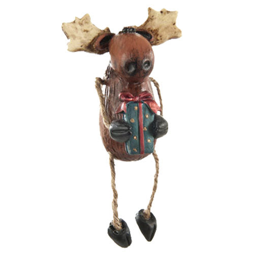 Decorative moose figurine holding a gift box on a white background