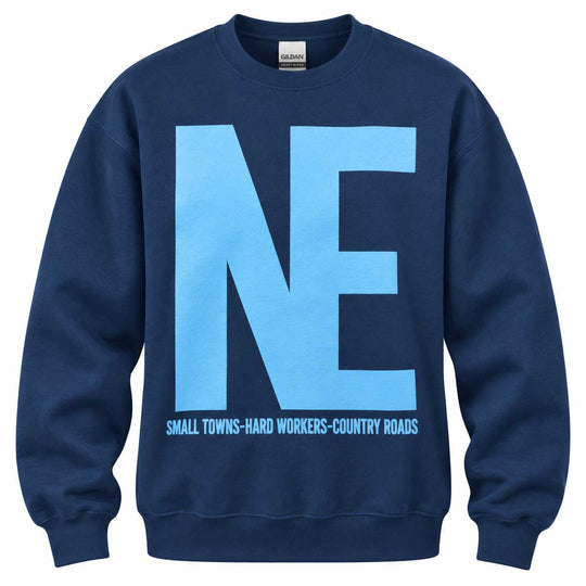 A navy blue crewneck sweatshirt featuring a large light blue 'NE' graphic on the front with the text 'SMALL TOWNS-HARD WORKERS-COUNTRY ROADS' printed underneath.