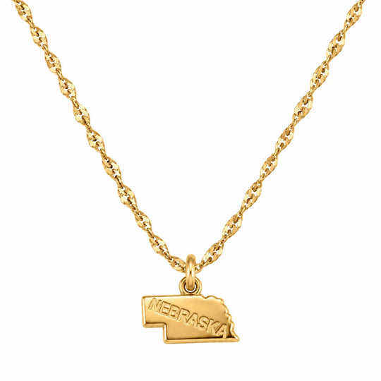 A gold necklace featuring a twisted chain and a small pendant shaped like the state of Nebraska, with the word 'NEBRASKA' engraved on the front, shown against a plain white background.