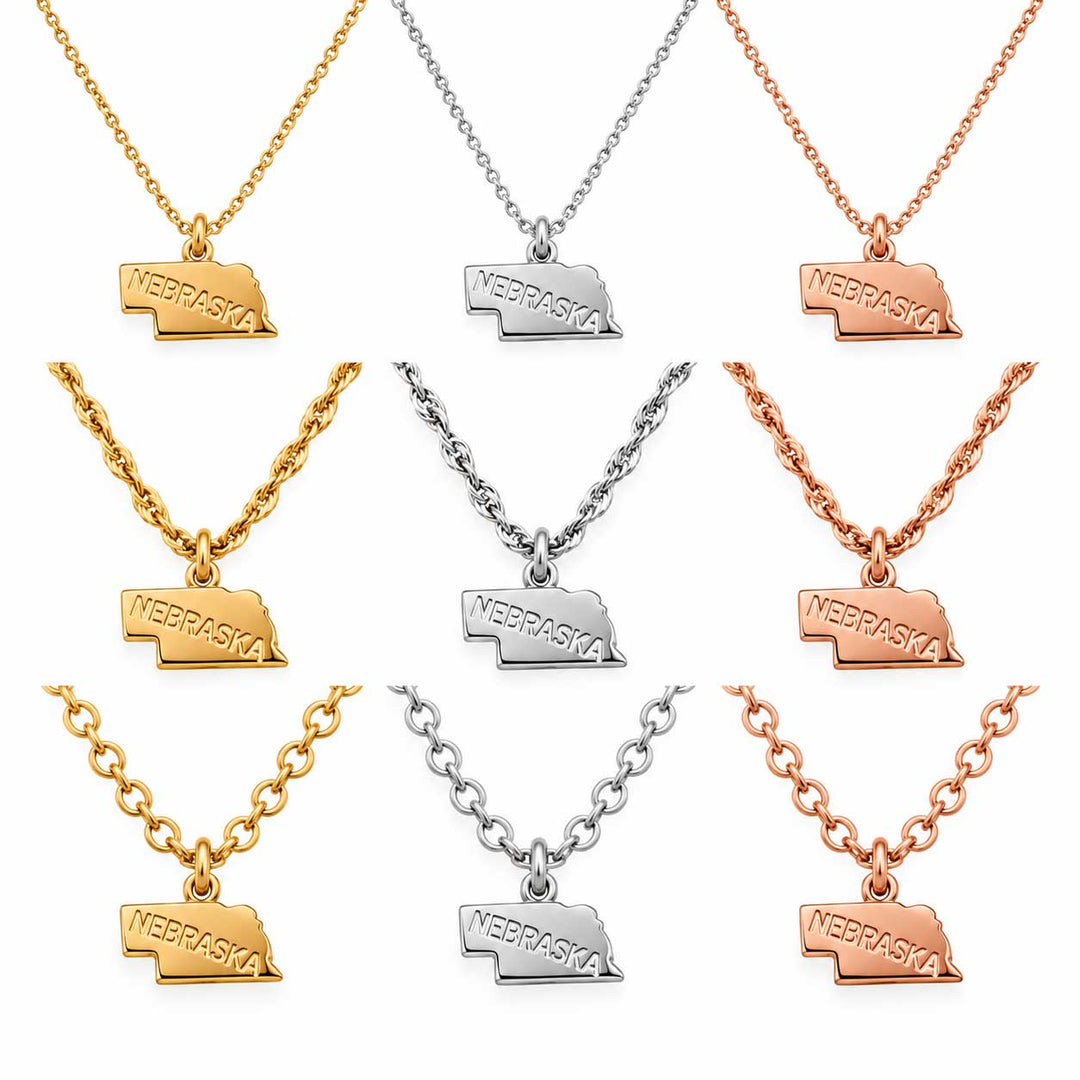 Nine Nebraska-shaped pendant necklaces arranged in a 3x3 grid on a white background, shown in yellow gold, silver, and rose gold finishes.
