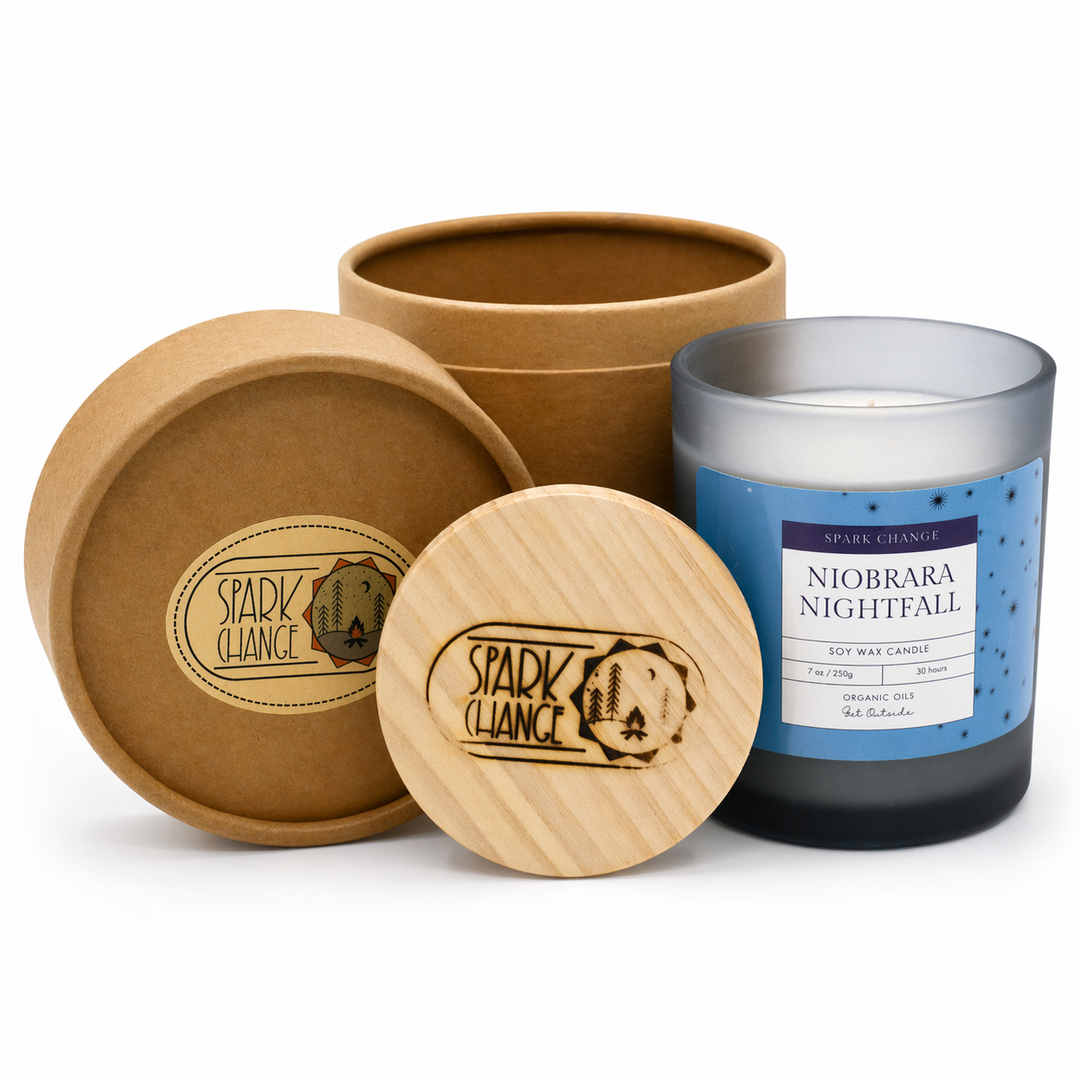 Candle with wooden lid and packaging on a white background