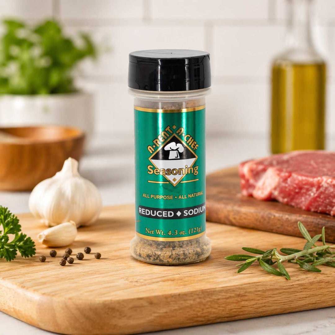 Seasoning bottle on a wooden cutting board with ingredients in the background