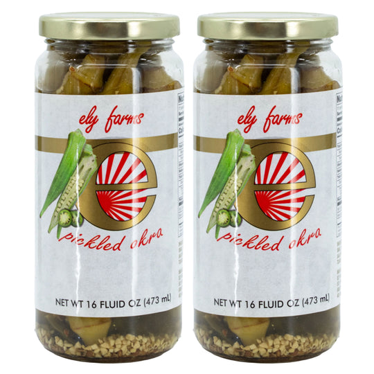 Two jars of Ely Farms pickled okra on a white background
