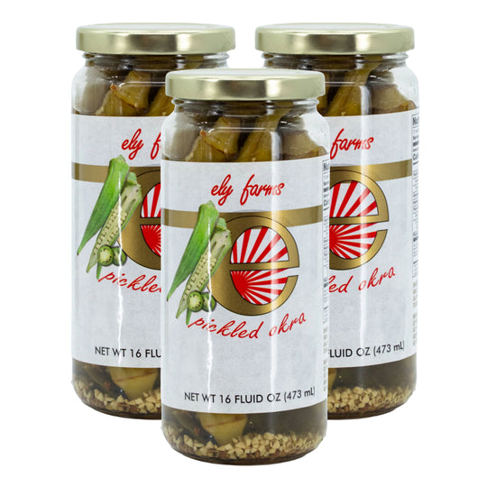 Three jars of Ely Farms pickled okra on a white background