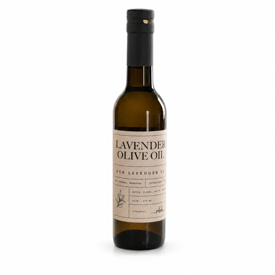 Bottle of lavender olive oil with a label on a white background