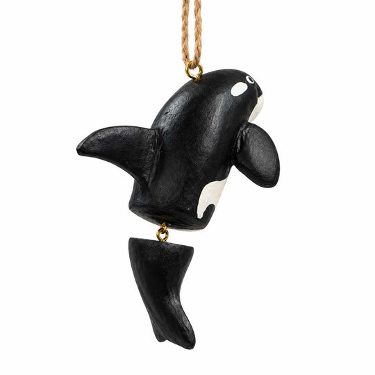 A black and white painted orca whale hanging ornament with a gold-colored metal chain and a small gold loop at the bottom, shown against a plain white background.