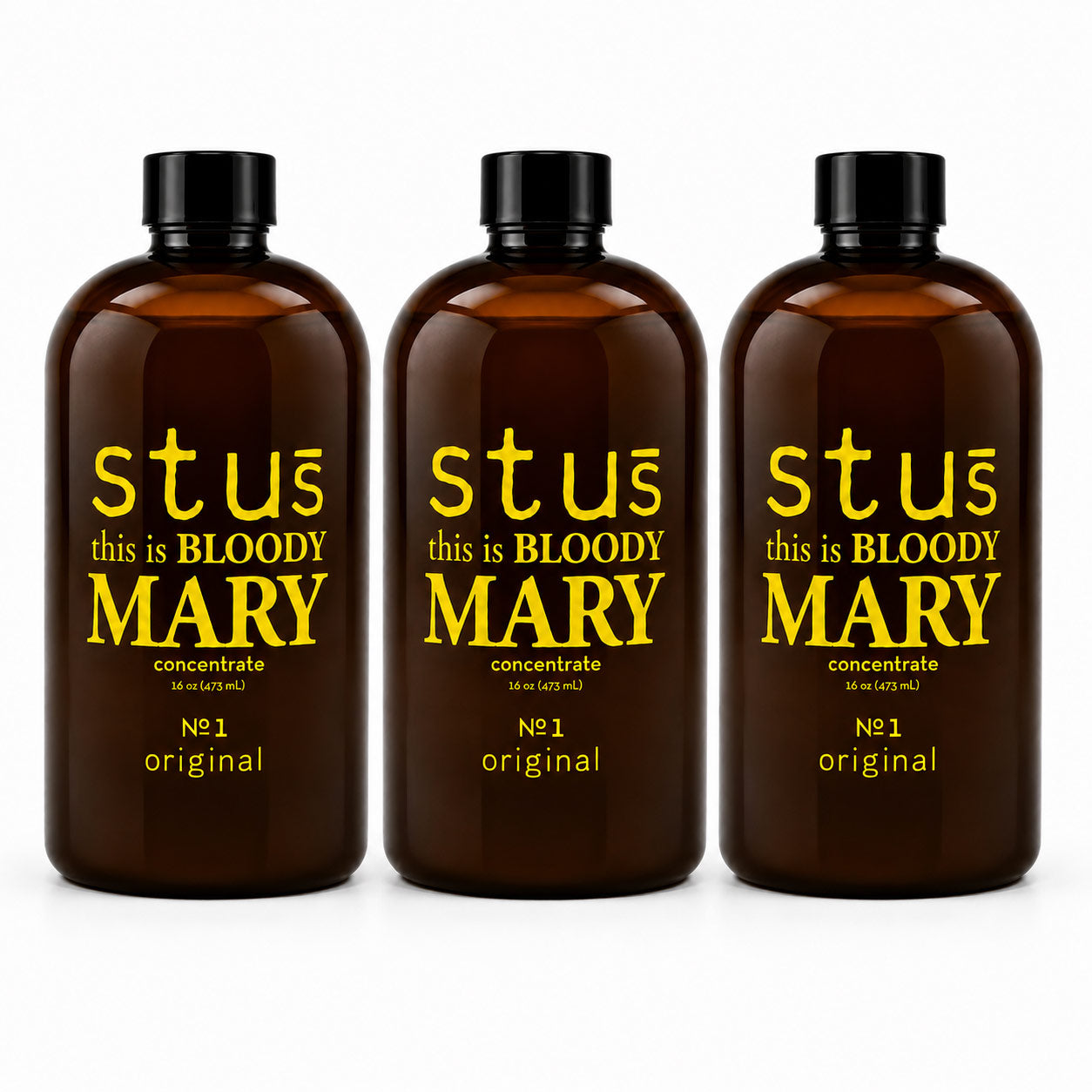 Three amber glass bottles with black caps and yellow text reading 'stuć this is BLOODY MARY concentrate' and 'Nċ1 original', shown on a white background.