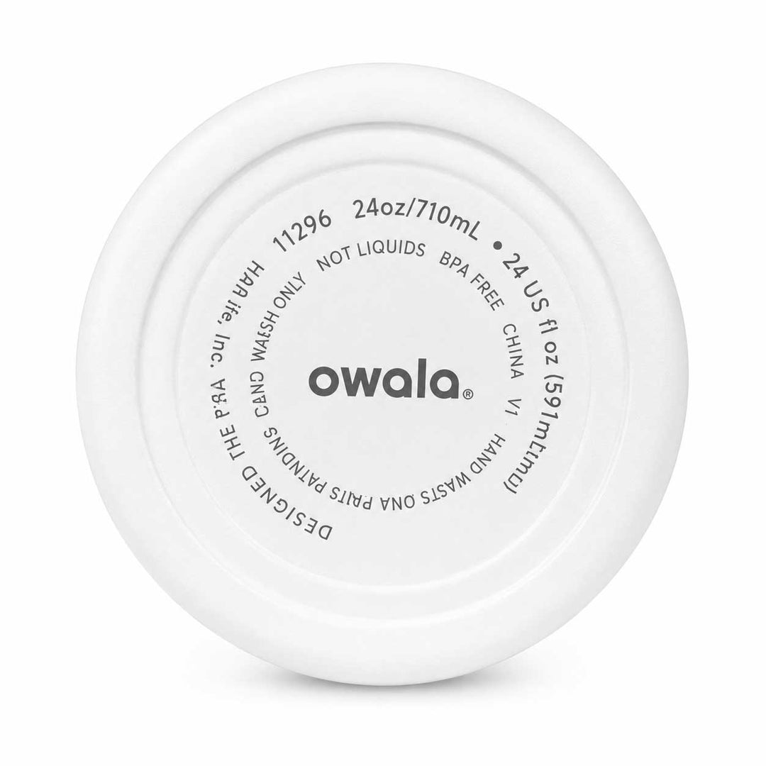 The underside of a white Owala flip-flop swim shoe, showing the molded plastic base with printed specifications and the brand name 'owala' in the center.