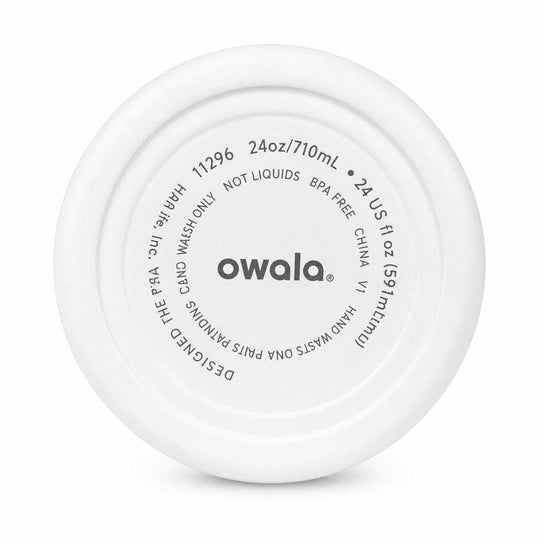The underside of a white Owala flip-flop swim shoe, showing the molded plastic base with printed specifications and the brand name 'owala' in the center.