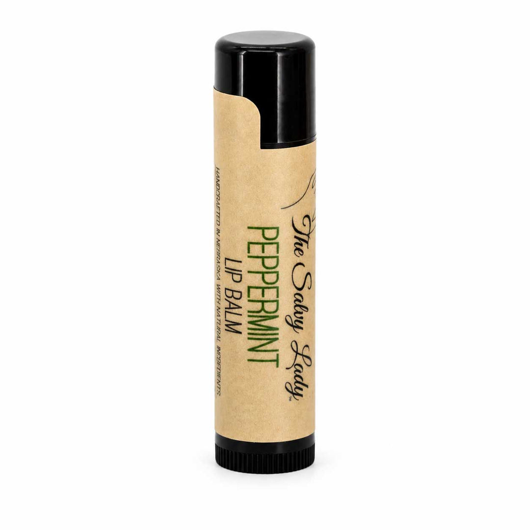 Peppermint lip balm with a black cap on a white background