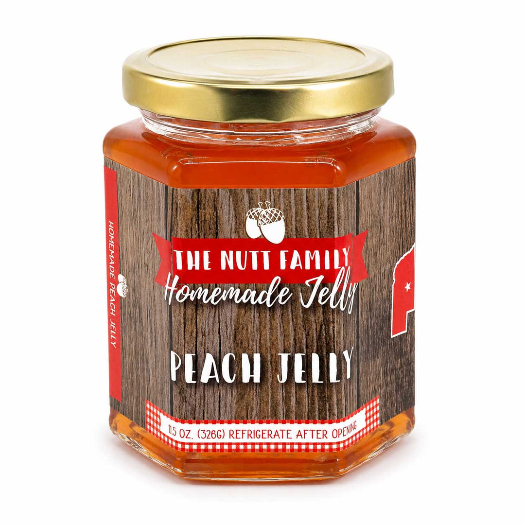 Jar of peach jelly with a wooden-textured label on a white background