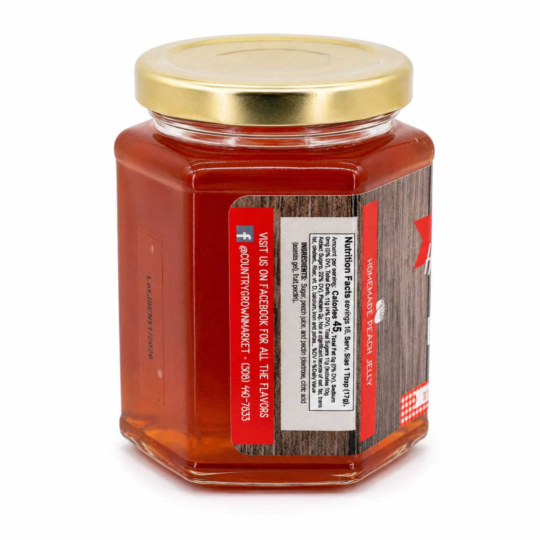 Jar of jelly with a gold lid on a white background