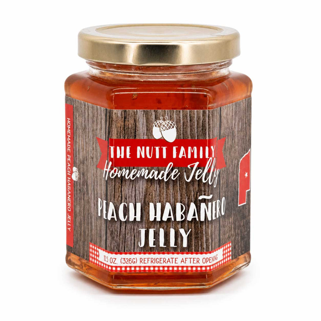 Jar of Peach Habanero Jelly with a wooden-textured label on a white background
