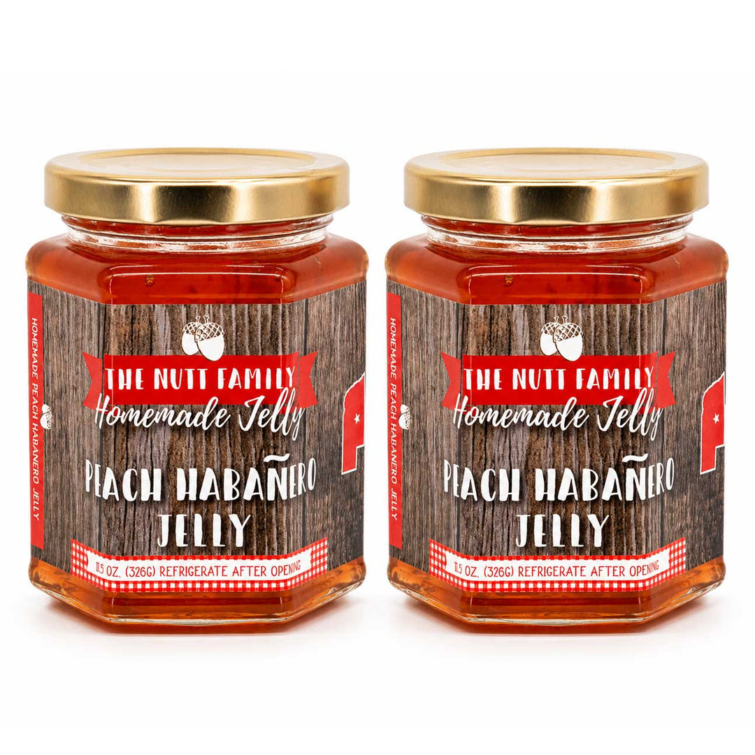 Two jars of Peach Habanero Jelly with a wooden label on a white background