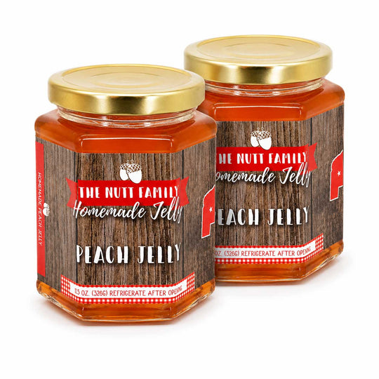 Two jars of Peach Jelly with a wooden design and gold lids on a white background