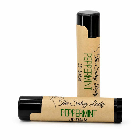 Two lip balm sticks with 'The Salvy Lady' branding on a white background