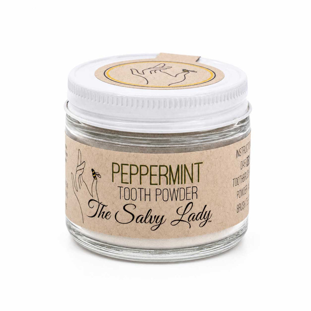 Jar of peppermint tooth powder with 'The Salvy Lady' label on a white background
