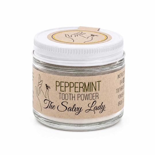 Jar of peppermint tooth powder with 'The Salvy Lady' label on a white background
