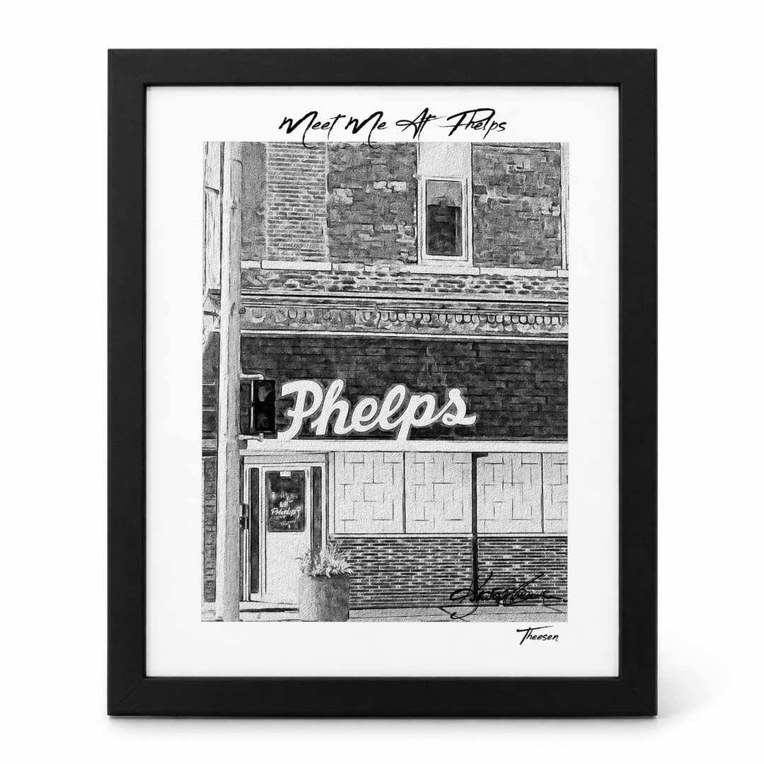 Framed black and white print of a building facade with 'Phelps' sign.