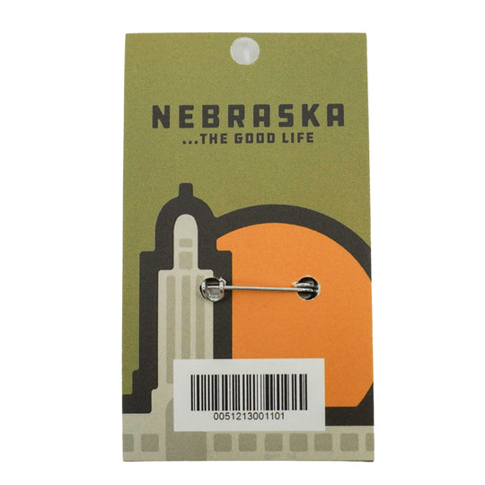 Pin with Nebraska design on a green card