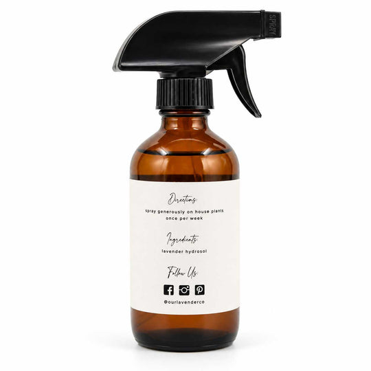 Brown spray bottle with black nozzle on a white background