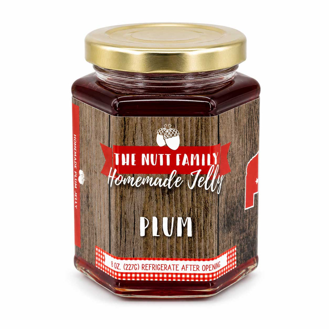 Jar of plum jelly with a wooden-textured label on a white background