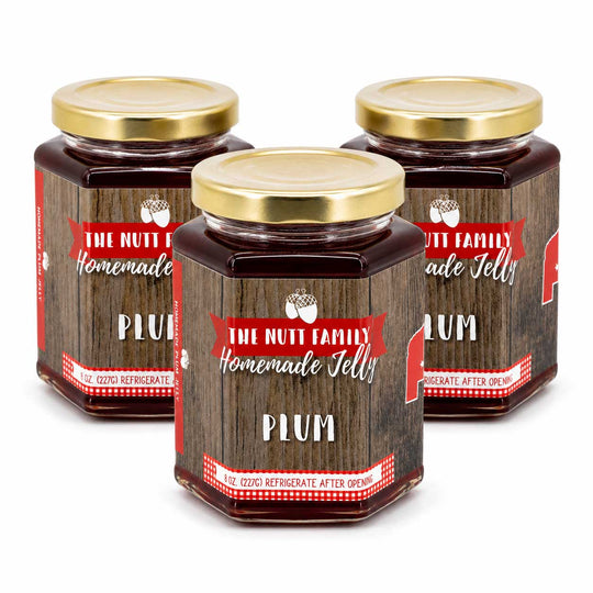 Three jars of 'The Nutt Family Homemade Jelly' plum jelly on a white background