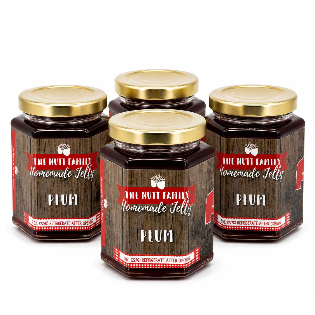 Four jars of Plum Jelly from The Nutt Family Homemade Jelly on a white background