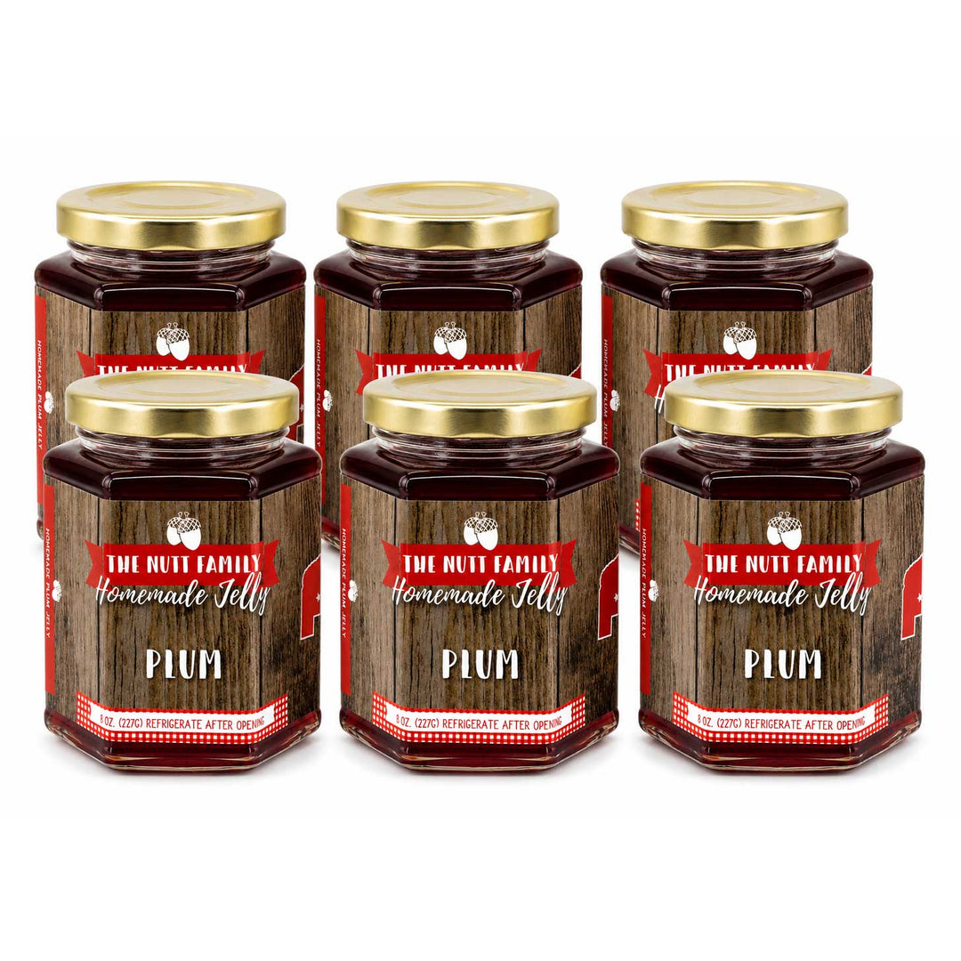 Six jars of plum jelly with wooden design labels on a white background