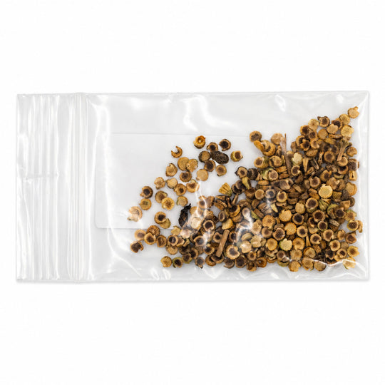 Clear plastic bag with dried herbs on a white background