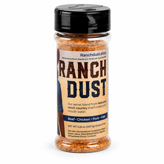 Container of Ranch Dust seasoning with a black lid on a white background