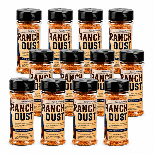 Multiple bottles of Ranch Dust seasoning on a white background