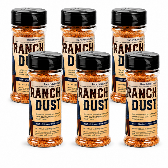 Multiple bottles of Ranch Dust seasoning on a white background