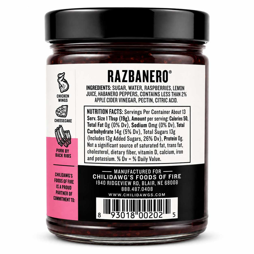 Razbanero pepperoni jam in a clear glass jar with a black lid and a white label featuring a pink side panel, photographed against a black background.
