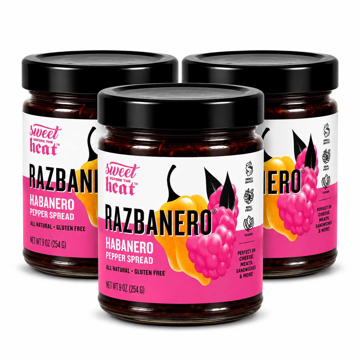 Three glass jars of Sweet Heat RAZBANERO Habanero Pepper Spread arranged in a group on a white background.