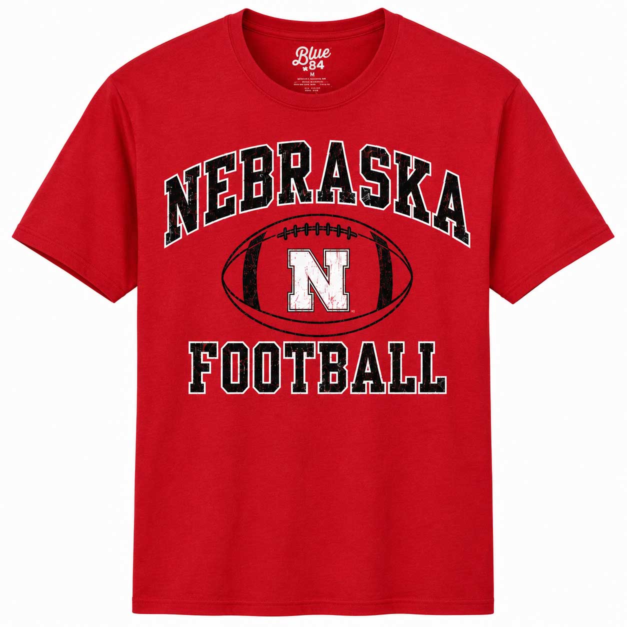 A red short-sleeve t-shirt with a 'Nebraska Football' graphic on the front, featuring a black and white football design with the letter 'N'.