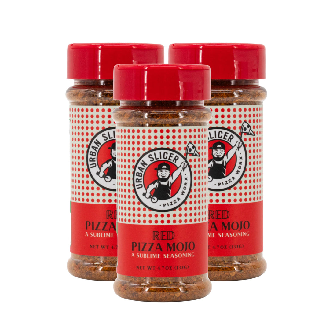 Three bottles of Urban Slicer Pizza Red Pizza Mojo seasoning on a white background