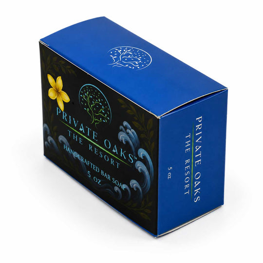 A 5 oz box of Private Oaks The Resort Handcrafted Bar Soap, featuring a blue and black design with a yellow flower graphic and white text, on a white background.