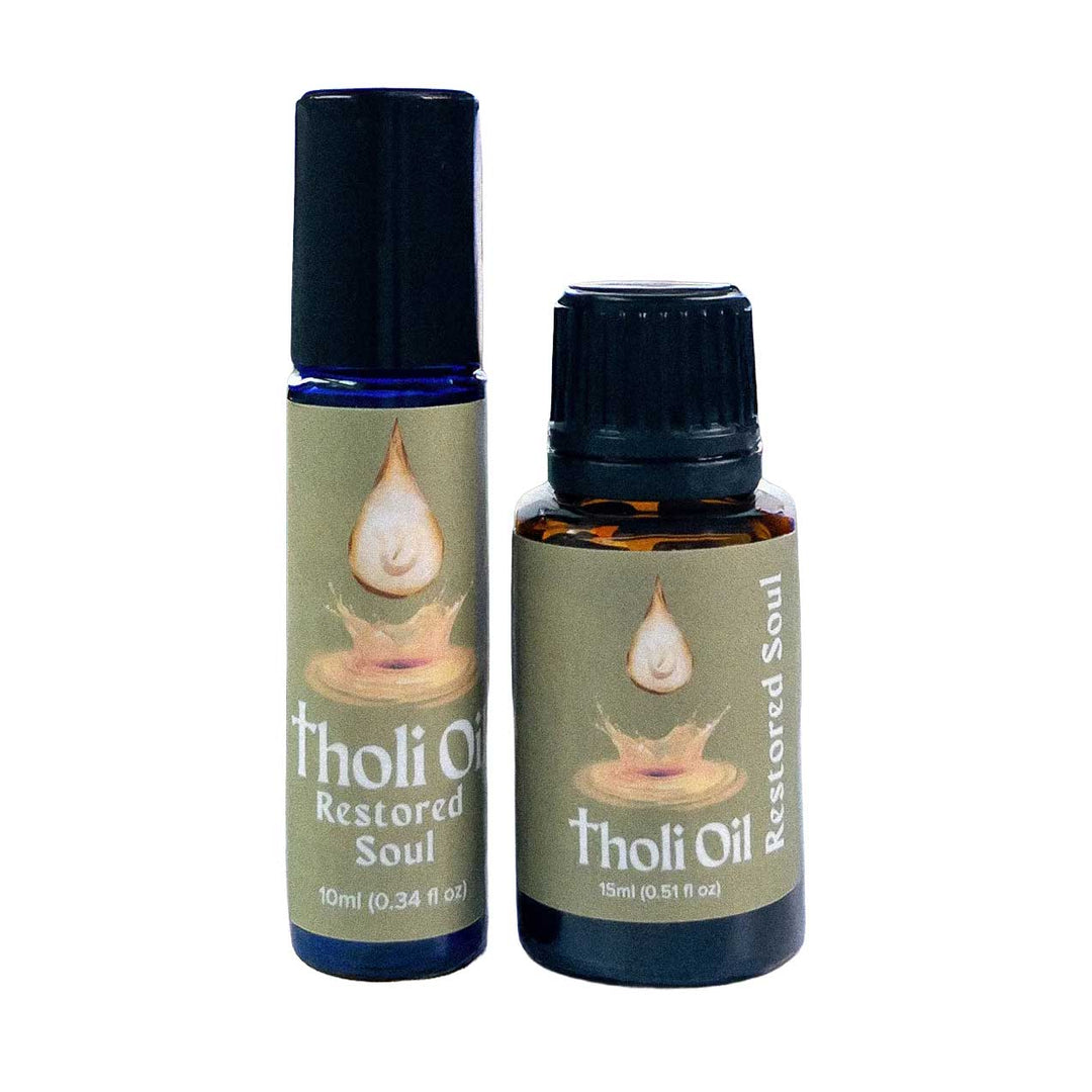 Two bottles of Tholi Oil 'Restored Soul' on a white background