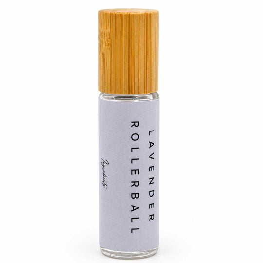 Rollerball bottle with wooden cap on a white background
