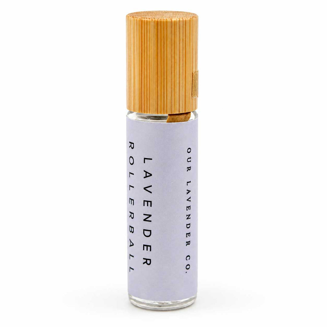 Rollerball bottle with wooden cap on a white background